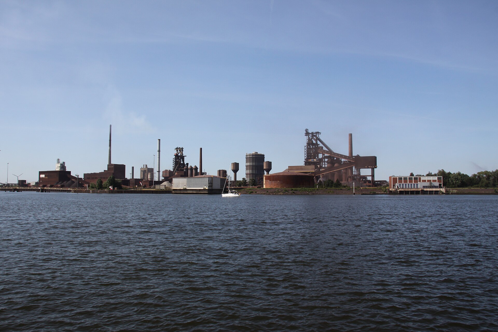 ArcelorMittal Bremen steelworks with blast furnaces seen across the river Weser