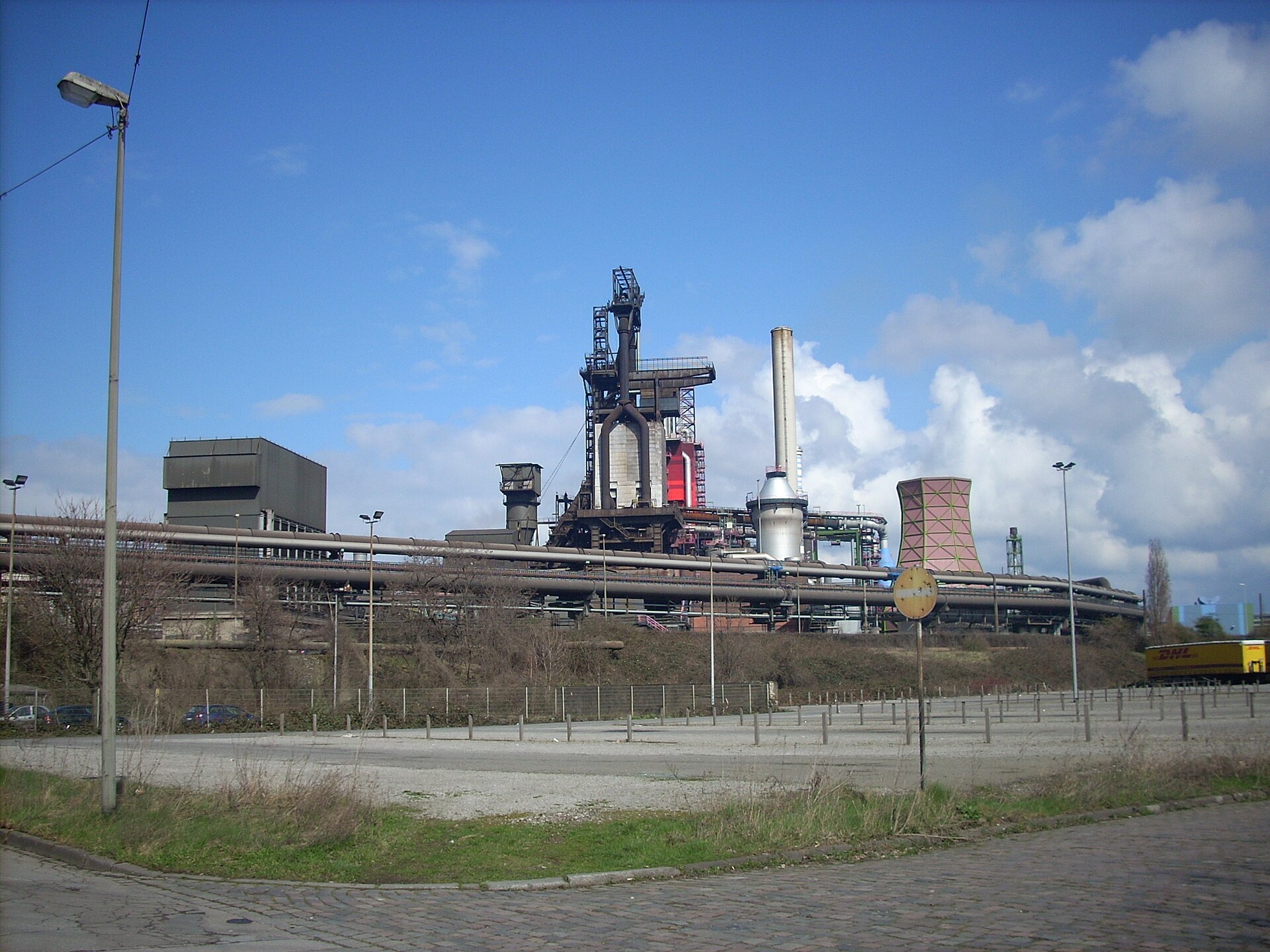 Blast furnace, stoves and pipe bridges of a thyssenkrupp Steel works under a blue sky
